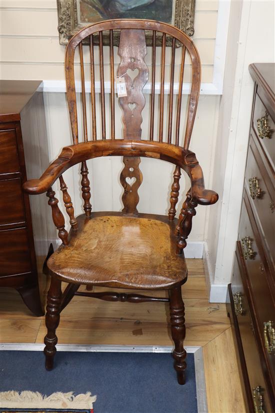 A harlequin set of six Victorian heart motif yew and elm Windsor chairs